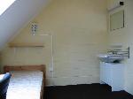 Cliquer ici pour agrandir la photo de la chambre 403 - le lit + l'évier